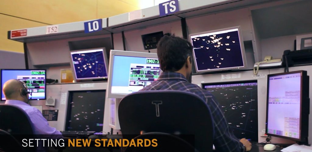 Air-traffic controllers working on NAV CANADA tower tech radar and data displays — “Setting New Standards” promo video still.