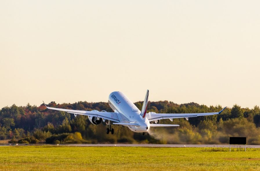 An Air France A220 departs from Airbus’s Mirabel site during a SAF delivery milestone.